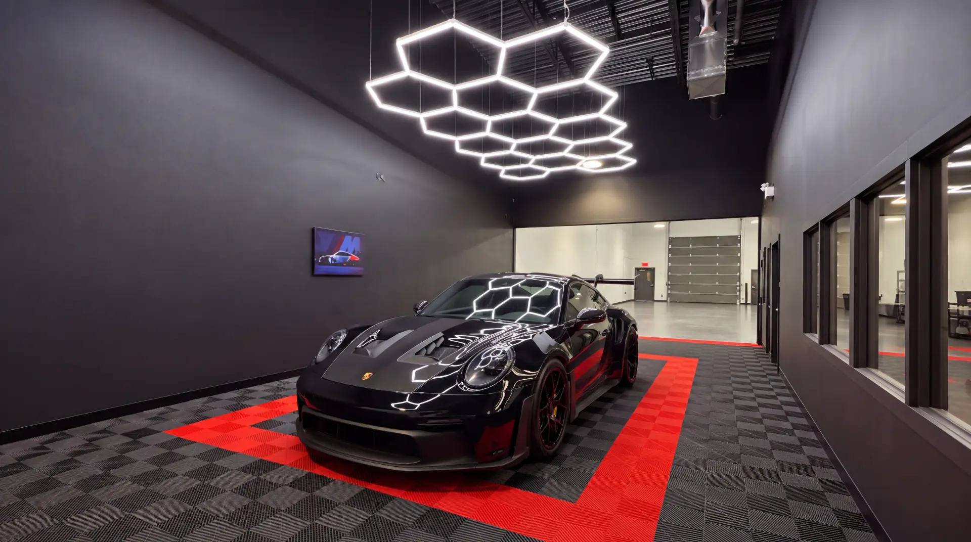 Black Porsche 911 inside Leclat Auto Salon